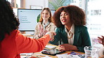 Women, handshake and business people in meeting, celebration and thank you in modern office. Employees, paperwork and group with success, documents and promotion with opportunity, thank you or review