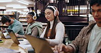 Girl, student and headphones with laptop in library for writing assignment essay, study music or exam research. University, group and person with notebook for online course, radio audio and education