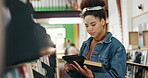 College, African woman and book with tablet in campus library for fact check study or online course. University, elearning and student with academy digital app for knowledge, info or project research