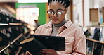 College, student and thinking with tablet in campus library for book study or online course. University, elearning and woman with comparison at academy for knowledge, info or project research