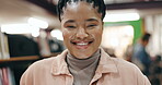 Happy, girl and face in library at university for exam study, educational research and learning for scholarship. African student, person and portrait with smile at college for development and pride