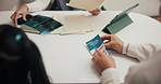 Dentist, brochure and people in clinic for consultation on mouth hygiene procedure for oral care. Paper, booklet and hands of orthodontist with patients for dental appointment together in office.