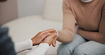 Woman, therapist and holding hands in office, counseling and support in mental health depression. Patient, doctor and insurance for psychology wellness on couch, advice and kindness in rehabilitation