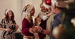 Happy, family and dance on Christmas at house for festive celebration, social reunion and movement in lounge. Excited, people and kid with hat, group performance and new years fun of bonding together