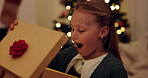 Christmas, child and excited in home with gift, surprise and happy in living room. Young girl, present and wow with box for festive celebration, season tradition and gratitude for new toy or wish