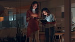 Women, tablet and smile at night in office with app, review and laughing with progress by window, Business people, partnership and advice with collaboration, teamwork and feedback at creative agency