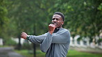 Stretching, fitness and black man in park for exercise, marathon training and running. Sports, athlete and person outdoors for warm up, cardio workout and start for wellness, health and performance