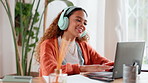 Music, laptop and happy woman typing in home office for creative research or editing article. Headphones, computer or African freelancer dancing for remote work, radio or journalist listen to hip hop