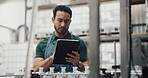 Asian man, employee and tablet for checklist at distillery for alcohol manufacturing and production at warehouse. Male person, manager and counting for gin bottles at factory for delivery and supply