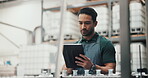 Asian man, manager and tablet for checklist at distillery for alcohol manufacturing and production at warehouse. Male person, employee and counting for gin bottles at factory for delivery and supply