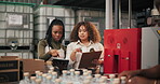 People, checklist or stock in factory for logistics, planning or export in gin distillery. Women, tech or clipboard at bottles for quality assurance, inventory inspection or wholesale alcohol supply