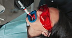 Dentist, person and hygiene with syringe for teeth whitening, gel or above with hands for healthcare at clinic. Doctor, patient and tools with cheek retractor, cleaning and transformation at hospital