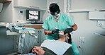 Teeth, cleaning and man with dentist in office for oral hygiene, healthcare and plaque removal. Dental, service and work with equipment in consultation for appointment, procedure or cavity prevention