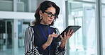 Employee, woman and serious with tablet at office for email notification, message and schedule. Female person, business and scrolling internet or website for news update and investment returns