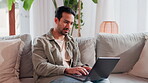 Home, man and relax with laptop on sofa for ecommerce website, research and reading reviews. Internet, network and male person with technology on couch for online shopping, application or information