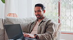 Home, man and smile with laptop on sofa for ecommerce website, application and reading reviews. Network, internet and male person with technology on couch for online shopping, research or information