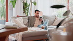 Home, chatting and man with cellphone, typing and internet for social media, connection and text. Happy person, apartment and guy on sofa, smartphone and digital app for email, online game or message