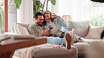 House, typing and couple with cellphone, love and bonding together in living room. Relationship, man and woman on couch, mobile user or smartphone with social media, internet and connection in lounge