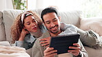 Talking, watch and couple with tablet, home and bonding in lounge, comedy and relax with internet videos. Love, funny and rest on couch, man and woman in living room, movies and chilling in weekend