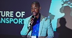 Microphone, seminar and black man speaker with presentation on podium for vehicle innovation. Speech, tradeshow and African male logistics engineer talking at convention for future of transportation.