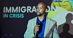 Black man, talking or tablet at presentation for information, news or immigration crisis awareness. Presenter, tech or mic in conference room for public speaking, problem solving or report in seminar