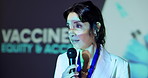 Woman, speaker and talk at convention, stage and info for inclusion, equality and accessibility to vaccine. Person, mic and presentation with call to action for pharma industry at global conference