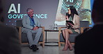 Man, woman and interview at conference, stage and discussion for ai governance, compliance or policy. People, speaker and mic for information, safety or future of digital transformation at convention