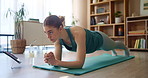 Plank, tablet and watch with woman on mat in living room of home for exercise or fitness. Time, training and workout with athlete person in apartment for health, online class or performance routine