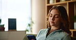 Phone, relax and woman on sofa in home with depression for breakup text with toxic relationship. Technology, rest and female person with cellphone for networking on couch in living room at apartment.