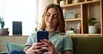 Cellphone, smile and woman on sofa in home for text on dating app for online connection in living room. Relax, technology and happy female person with phone for finding love on social media at house.