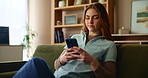 Cellphone, happy and woman on sofa in home for text on dating app for online connection in living room. Relax, technology and female person with phone for finding love on social media at house.