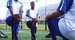 Football, team and player with stretching for fitness on field with leg warm up, exercise or workout for competition. Sport, men and training on grass pitch for soccer game, performance or tournament