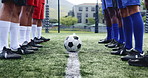 Soccer, team and legs with ball on grass field for kick off, start or beginning match. People, feet or football players in tournament for sports, game or five a side on attack or defense on turf