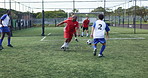 Football, team and match on field for goal, support and competitive tournament. Men, soccer players and sport at community outreach program for practice, training and challenge on grass at facility