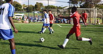 Football, team and game on field for challenge, support or competitive tournament. Men, soccer players or sport at community outreach program for practice, training and technique on grass at facility