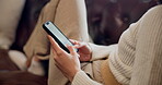 Home, closeup and person with smartphone for typing, text message and dating website for chat on sofa. Living room, hands and woman with cellphone for mobile app, connection and social media on couch