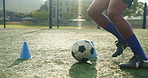 Feet, person and dribble with cone for soccer of fitness practice, running guide and exercise performance. Athlete, beacon and ball challenge with sports football, agile and game training on field