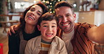 Christmas, selfie and face of child with parents in home for holiday, vacation and festive season. Happy family, smile and portrait of kid, mom and dad for profile picture, memory and social media