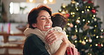 Christmas, child hug and family with mother and smile for holiday and celebration in home. Living room, youth and young boy with  love, care and support together for vacation with parent bonding