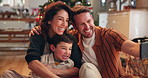 Christmas, happy and selfie of parents with kid in home excited for holiday, vacation and festive celebration. Family, smile and mom, dad and child take photo for social media, memory and bonding