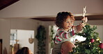 Christmas, decoration and girl on shoulders of father in living room of home for festive celebration. Family, tree or vacation with parents and girl child in apartment together for December vacation