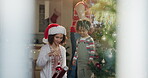 Christmas, decoration or ornament with mother and daughter in living room of home for celebration. December, festive or tree with single parent child and girl child in apartment for holidays together