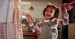 Parents, girl and smile with dancing on Christmas at home for fun, break and celebration. People, family and happy with kid jumping in living room on festive season for unity, love and support