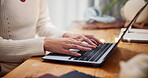 Hands, girl and typing with laptop at house for social media blog, copywriting and website research. Woman, freelancer and scroll for online story, email agency and reporter information of article