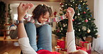 Christmas, father and happy child play airplane game for holiday, support or balance. Xmas, girl and dad lift kid for love, care and holding hands together in living room for bonding in family home