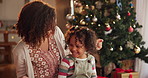 Happy, tickling and mother with child for Christmas celebration, party or event in home. Laughing, playing and mom with girl kid for festive, xmas and holiday with family tie for bonding together.