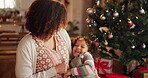 Woman, child and Christmas tree for festive holiday and celebration as happy family in home. Female person, kid and together for bonding with tickle, excited and loving on winter vacation in December