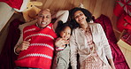 Christmas, smile and wave with family on floor in living room of home together for celebration. Family, love or portrait of mother, father and daughter in apartment for festive holidays from above