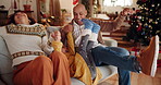 Bonding, parents and child in Christmas, playing and fun with daughter, games or relax for holiday. House, woman and man with girl, living room and love for festive, celebration and family with smile