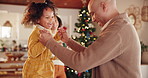 Jumping, parents and child in Christmas, playing and fun with daughter, games and relax for holiday. House, woman and man with girl, bonding and love for festive, celebration and family with smile